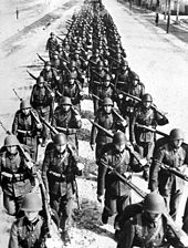 Photo of a column of troops marching